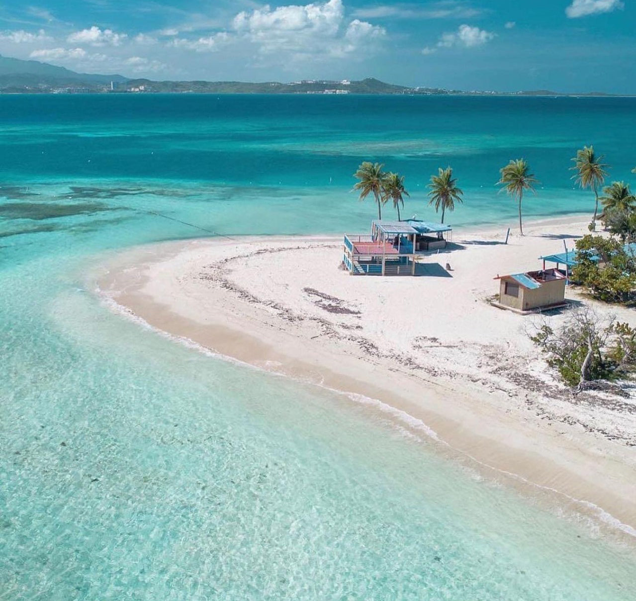 Private yacht anchored in clear turquoise water at Palomino Island off Fajardo, Puerto Rico